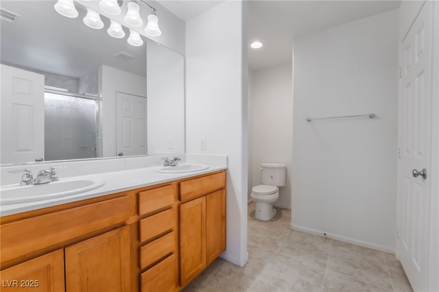 4436 Hatch Bend Ave, North Las Vegas, NV 89031 - full bathroom featuring double vanity, toilet, a sink, and a stall shower