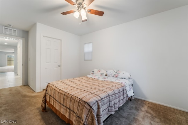 4436 Hatch Bend Ave, North Las Vegas, NV 89031 - bedroom with carpet floors, a ceiling fan, baseboards, and visible vents