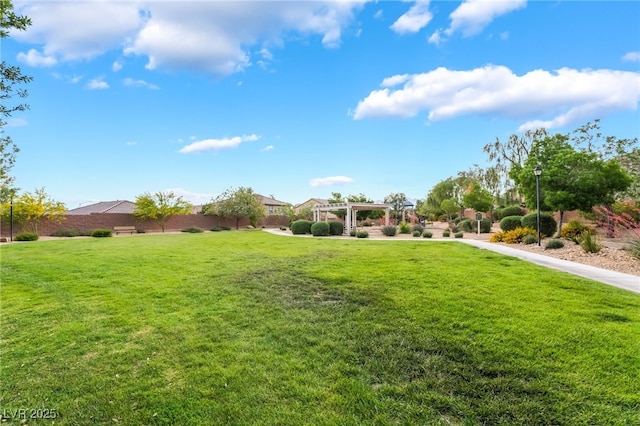 4436 Hatch Bend Ave, North Las Vegas, NV 89031 - view of yard featuring fence and a pergola