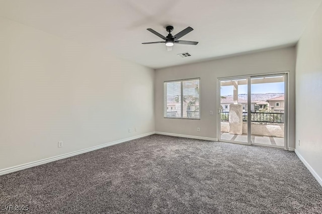 unfurnished room with carpet floors, ceiling fan, and baseboards