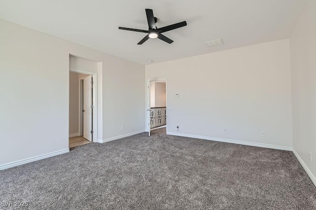 unfurnished bedroom featuring carpet floors, baseboards, and a ceiling fan