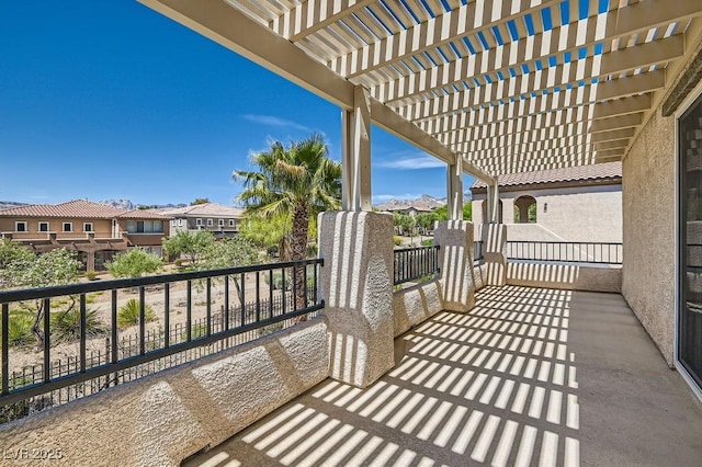 balcony with a residential view and a pergola