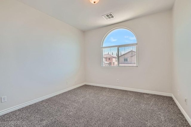 spare room with carpet floors and baseboards