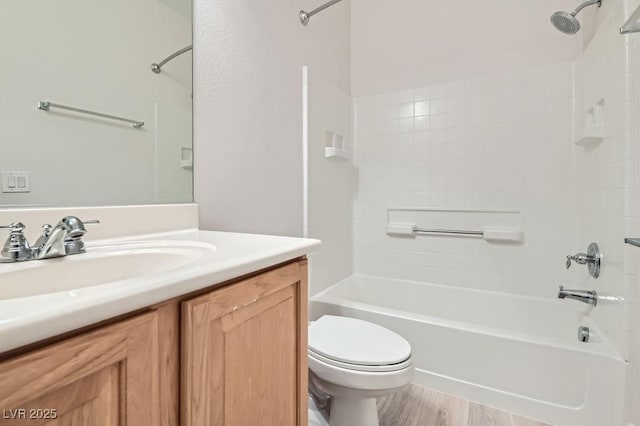 full bath with toilet, vanity, and bathing tub / shower combination