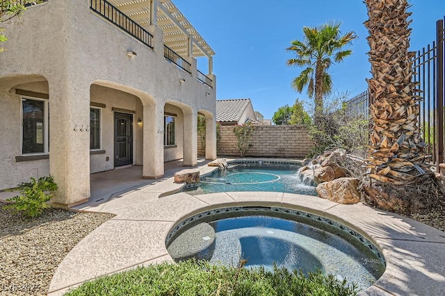 view of pool featuring an in-ground hot tub, a fenced backyard, and a patio area