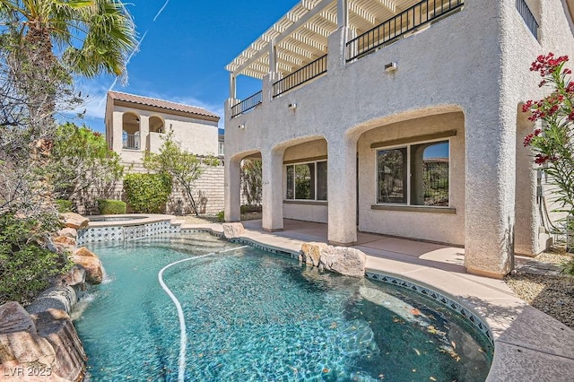view of pool featuring a patio area and a pool with connected hot tub