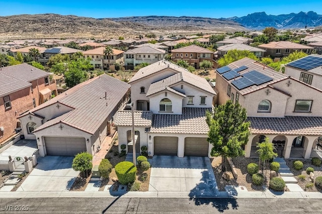 aerial view of residential area with a mountain backdrop