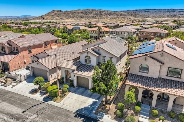 aerial view of residential area with a mountainous background