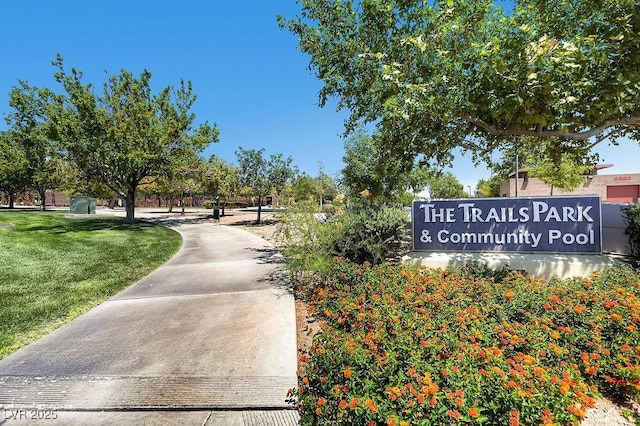 view of property's community with a lawn