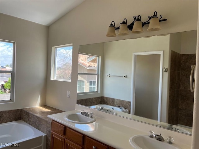 full bathroom with a sink, double vanity, and a bath