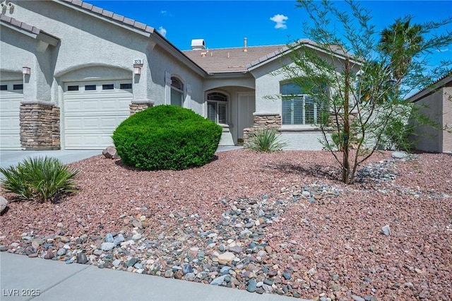 3278 Turning Bridge St, Las Vegas, NV 89135 - ranch-style house with stucco siding, a tile roof, stone siding, and a garage