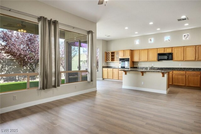 3278 Turning Bridge St, Las Vegas, NV 89135 - kitchen with visible vents, a ceiling fan, black appliances, and recessed lighting