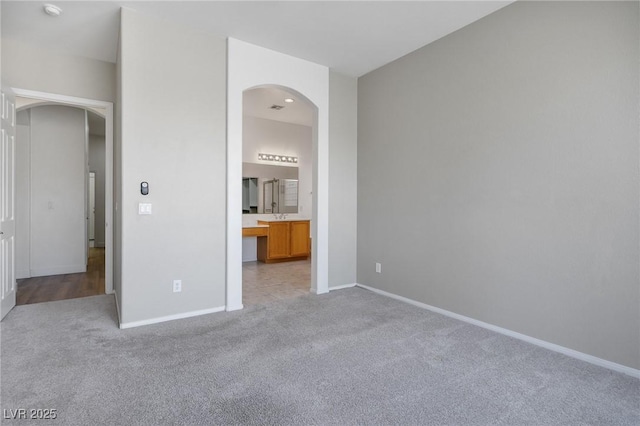 3278 Turning Bridge St, Las Vegas, NV 89135 - unfurnished bedroom featuring arched walkways, baseboards, and carpet floors