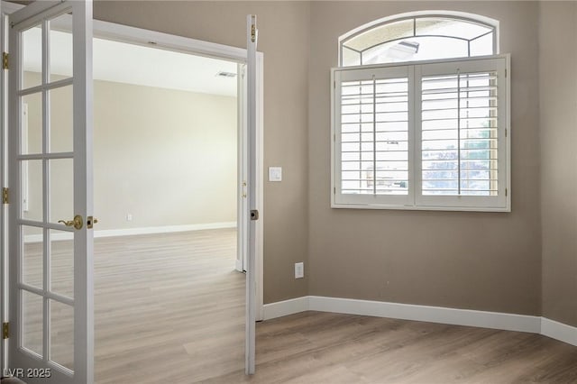 3278 Turning Bridge St, Las Vegas, NV 89135 - unfurnished room featuring baseboards, visible vents, and wood finished floors