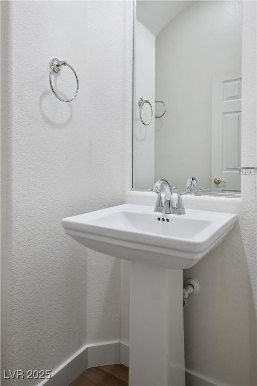 3278 Turning Bridge St, Las Vegas, NV 89135 - bathroom featuring a sink and wood finished floors