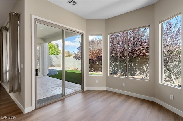 3278 Turning Bridge St, Las Vegas, NV 89135 - doorway with visible vents, plenty of natural light, and wood finished floors