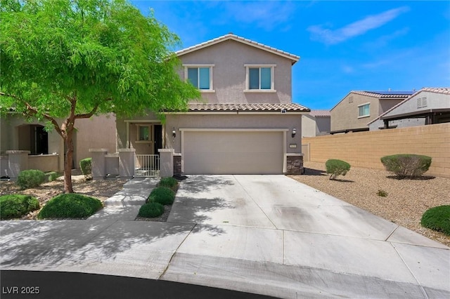 5631 Hill Cliff Ct, North Las Vegas, NV 89031 - view of front of house featuring a tiled roof, stucco siding, a garage, and driveway