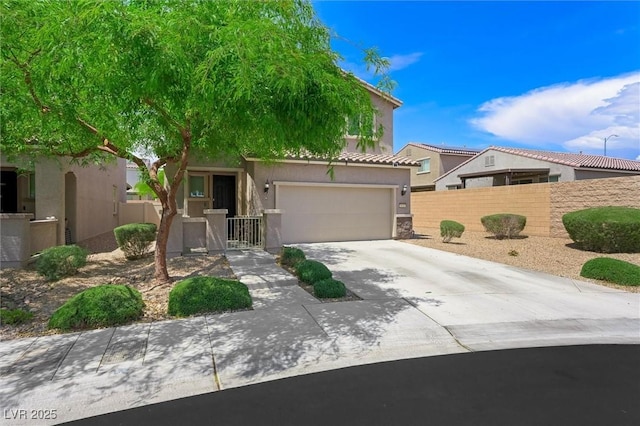 5631 Hill Cliff Ct, North Las Vegas, NV 89031 - view of front of home featuring driveway, stucco siding, an attached garage, and a tiled roof