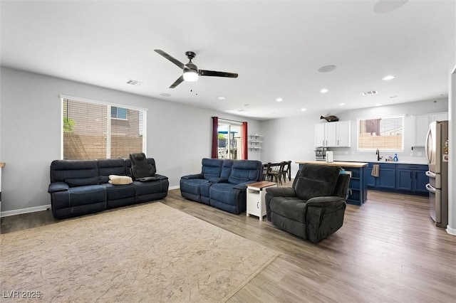 5631 Hill Cliff Ct, North Las Vegas, NV 89031 - living room featuring ceiling fan, healthy amount of natural light, wood finished floors, and recessed lighting
