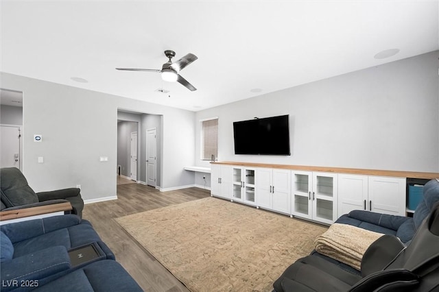 5631 Hill Cliff Ct, North Las Vegas, NV 89031 - living area featuring wood finished floors, baseboards, and a ceiling fan