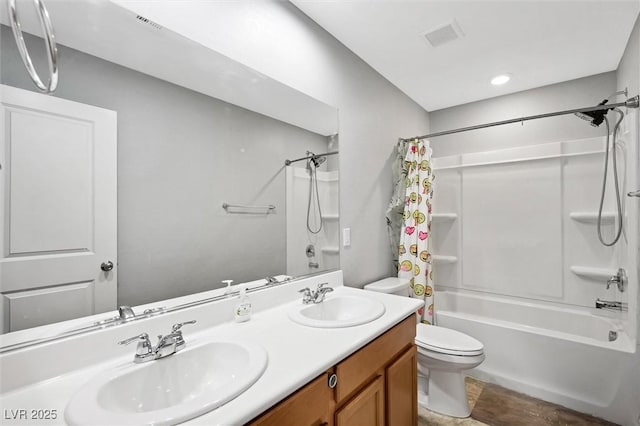5631 Hill Cliff Ct, North Las Vegas, NV 89031 - bathroom with toilet, shower / bath combo with shower curtain, and double vanity