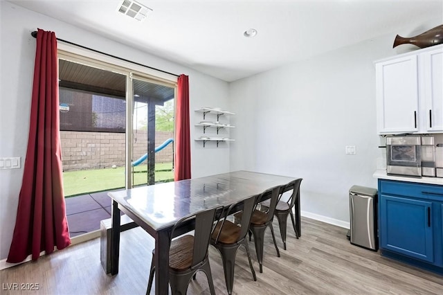 5631 Hill Cliff Ct, North Las Vegas, NV 89031 - dining room with light wood-type flooring and baseboards