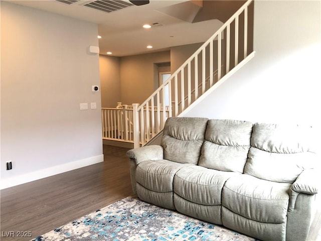 living area featuring baseboards, recessed lighting, wood finished floors, and visible vents