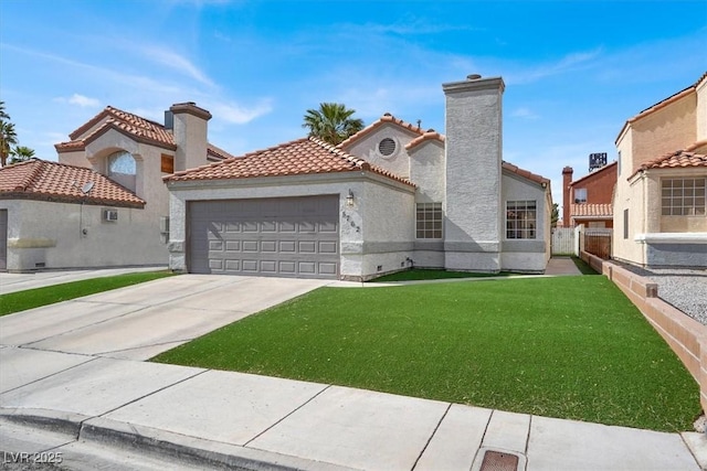 mediterranean / spanish home featuring a tile roof, a garage, stucco siding, a front yard, and concrete driveway