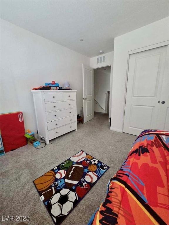 2872 Atomic Tangerine Way Unit 2, Las Vegas, NV 89183 - bedroom with carpet floors and a closet