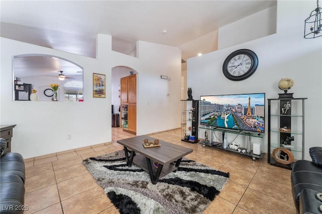 2903 Galena Peak Ln, Las Vegas, NV 89156 - tiled living room featuring arched walkways and ceiling fan