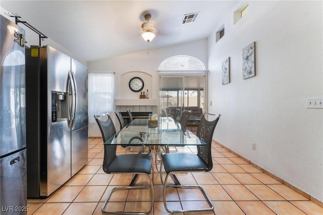 2903 Galena Peak Ln, Las Vegas, NV 89156 - dining area with light tile patterned floors, a ceiling fan, lofted ceiling, and visible vents