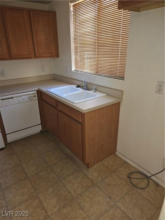 833 Aspen Peak Loop Unit 1524, Henderson, NV 89011 - kitchen featuring a sink, dishwasher, brown cabinets, and light countertops