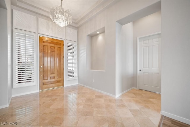 2742 Darby Falls Dr, Las Vegas, NV 89134 - entrance foyer with a chandelier and baseboards