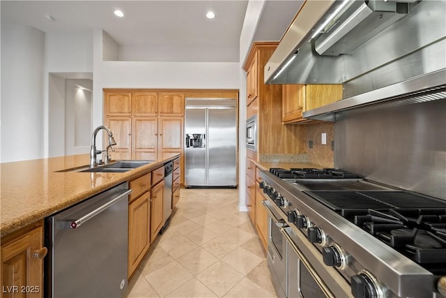 2742 Darby Falls Dr, Las Vegas, NV 89134 - kitchen with built in appliances, a sink, wall chimney exhaust hood, decorative backsplash, and light stone counters