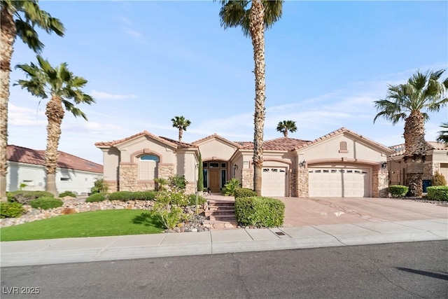 2742 Darby Falls Dr, Las Vegas, NV 89134 - mediterranean / spanish home featuring stucco siding, a garage, stone siding, driveway, and a tile roof