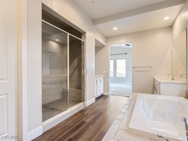 3008 Barrett Springs Ave, Henderson, NV 89044 - bathroom featuring vanity, baseboards, wood finished floors, and a shower stall