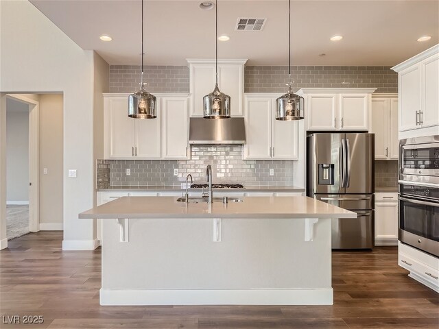 3008 Barrett Springs Ave, Henderson, NV 89044 - kitchen with light countertops, decorative backsplash, stainless steel appliances, and visible vents