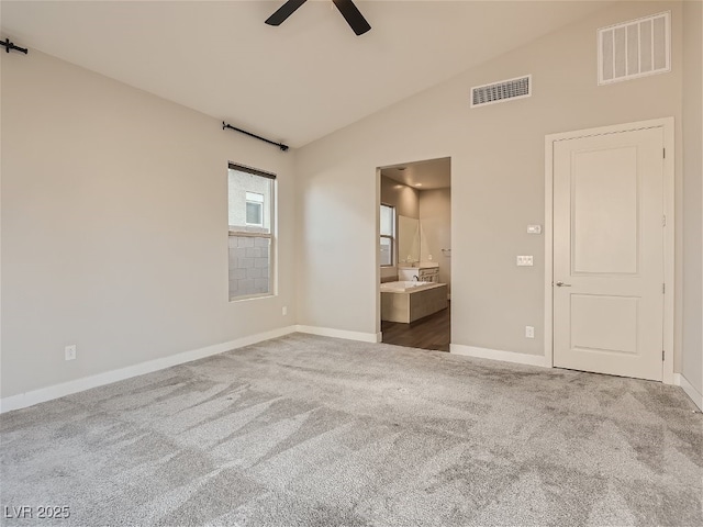 3008 Barrett Springs Ave, Henderson, NV 89044 - unfurnished bedroom with visible vents, baseboards, carpet, and lofted ceiling