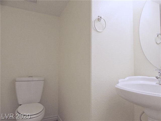 1004 Windy Ferrell Ave, North Las Vegas, NV 89081 - half bath with toilet and a sink