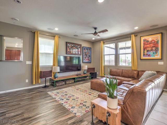 living area featuring baseboards, recessed lighting, ceiling fan, and wood finished floors