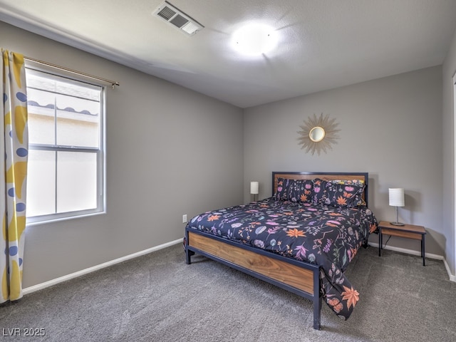 bedroom featuring baseboards, carpet, and visible vents