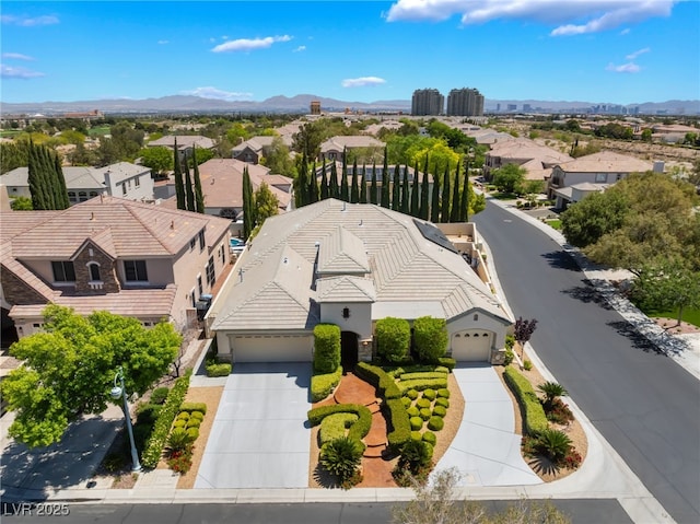 bird's eye view with a residential view and a mountain view