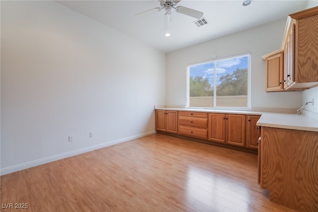 kitchen with light countertops, ceiling fan, recessed lighting, and light wood-style flooring