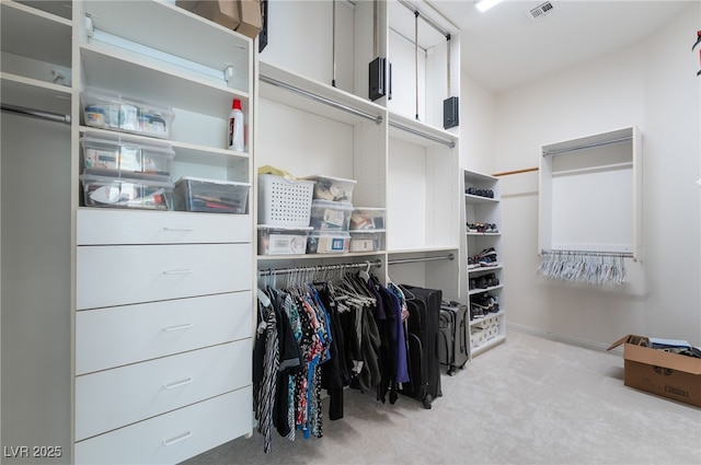 spacious closet featuring visible vents and carpet
