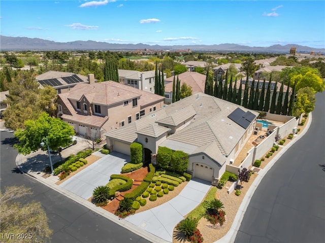 bird's eye view featuring a mountain view and a residential view