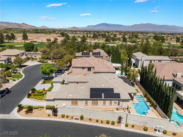 drone / aerial view with a residential view and a mountain view