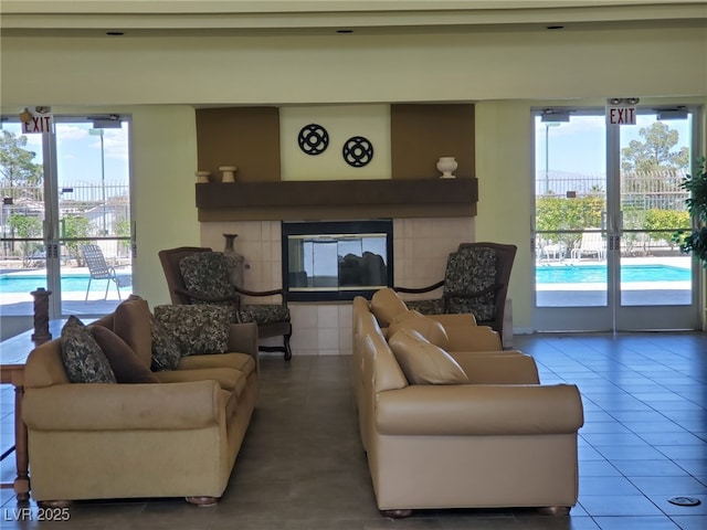 8070 W Russell Rd Unit 1028, Las Vegas, NV 89113 - tiled living area featuring healthy amount of natural light and a tile fireplace