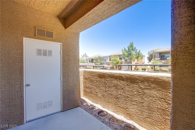 8070 W Russell Rd Unit 1028, Las Vegas, NV 89113 - property entrance featuring a balcony, stucco siding, and a residential view