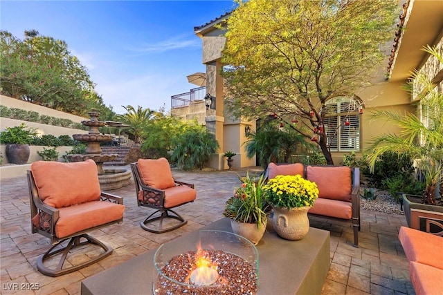 17 Grand Corniche Dr, Henderson, NV 89011 - view of patio / terrace featuring an outdoor living space with a fire pit and a balcony
