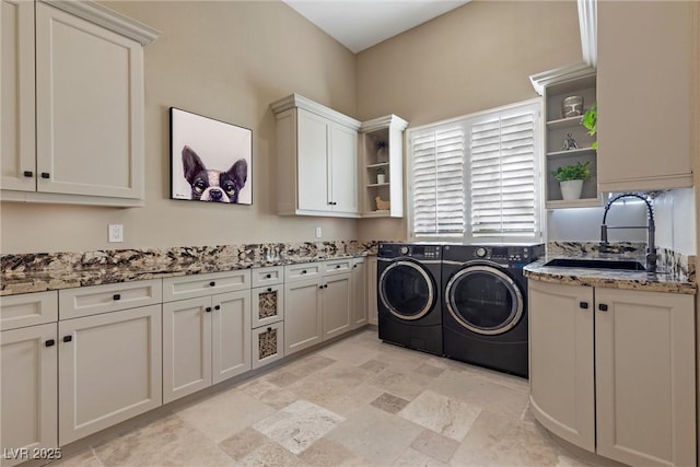 17 Grand Corniche Dr, Henderson, NV 89011 - washroom with a sink, stone finish floor, washing machine and dryer, and cabinet space